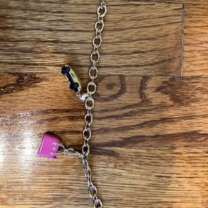 Kate Spade Charm bracelet with taxi and cedar street purse charms